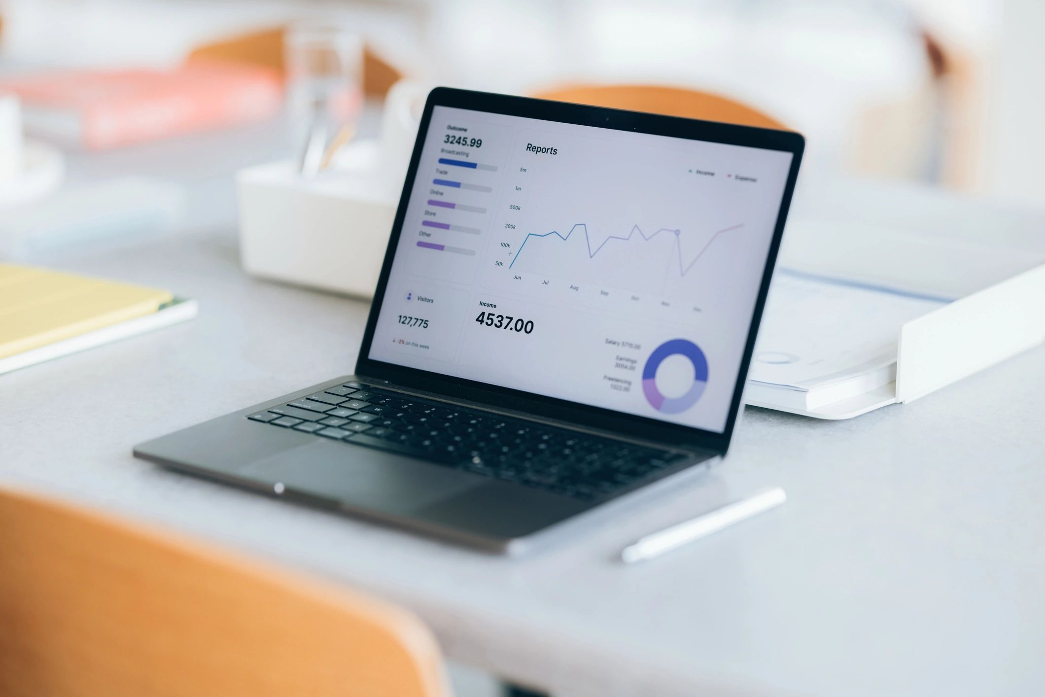 Analytics and strategy reports on a laptop, representing data-driven marketing planning